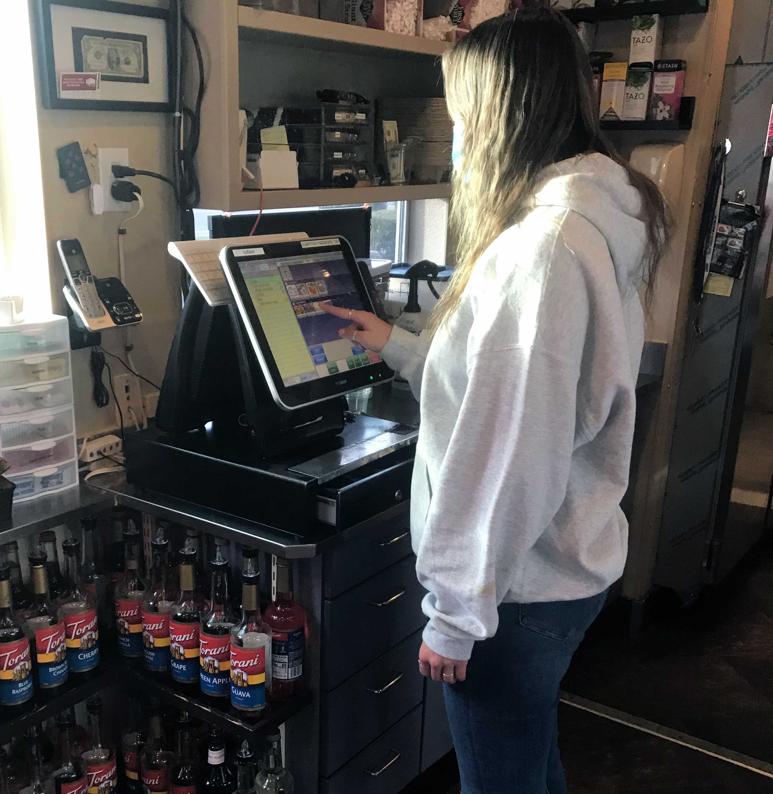 Woman taking order at Buffalo Espresso